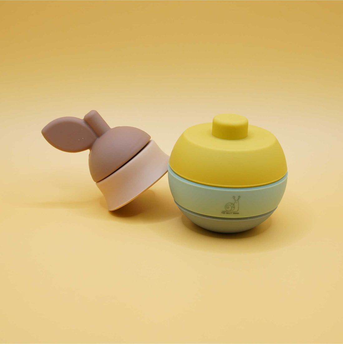 pieces apart of pear shaped silicone stacking toy