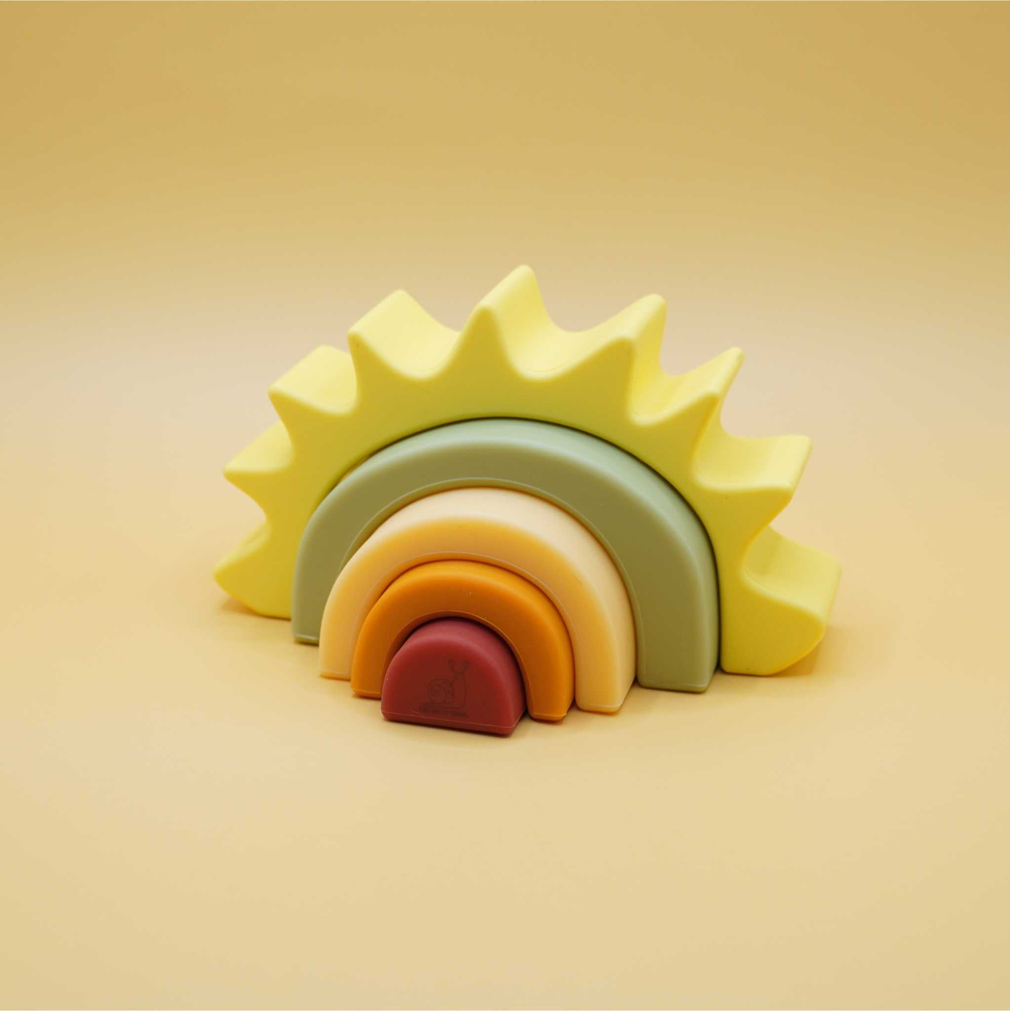pieces spread apart of sunrise silicone stacking toy